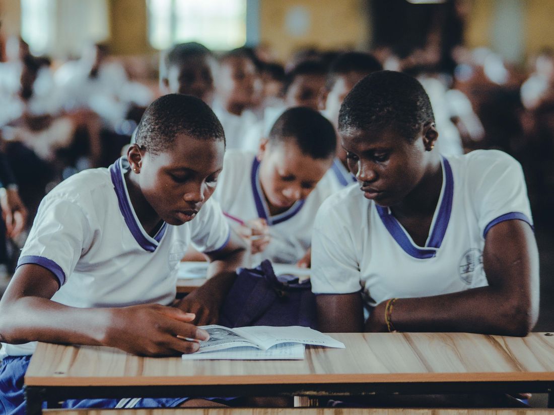 Students in a Zimbabwean classroom concentrating on their work